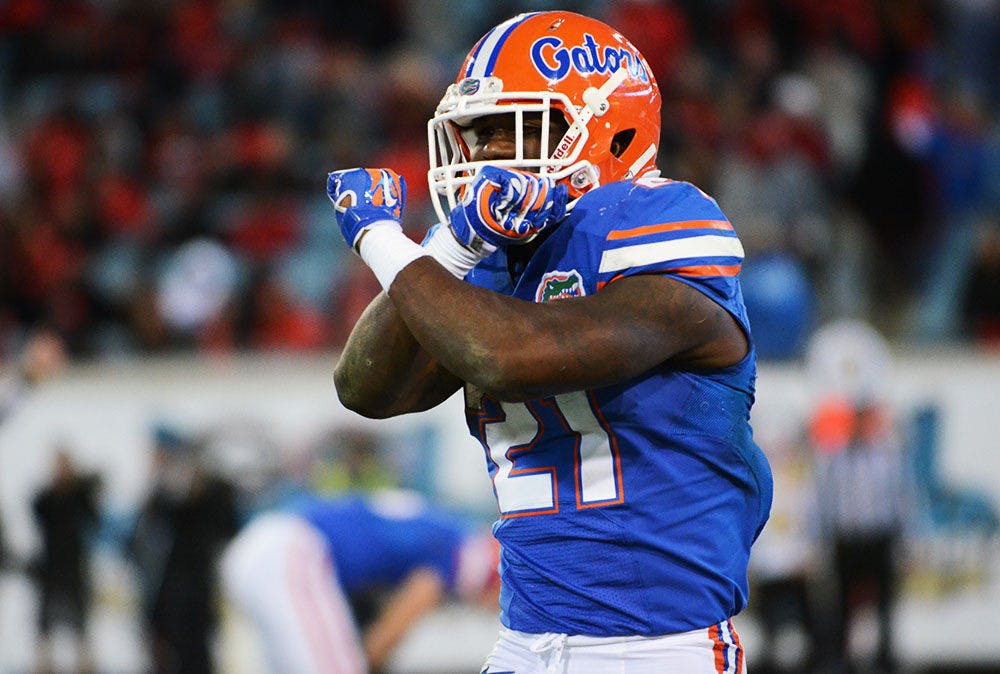 <p>Kelvin Taylor celebrates during Florida's 38-20 win against Georgia at EverBank Field in Jacksonville.</p>
