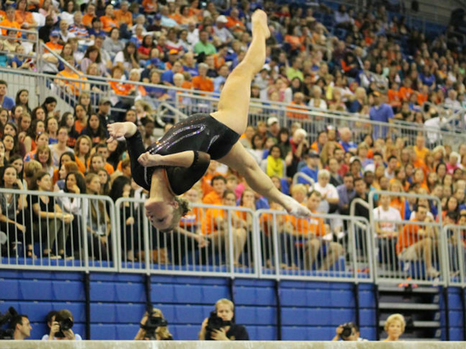 Bridget Sloan performs a flip on the balance beam during Florida’s win against Kentucky on Feb. 22, 2013, in the O’Connell Center.&nbsp;