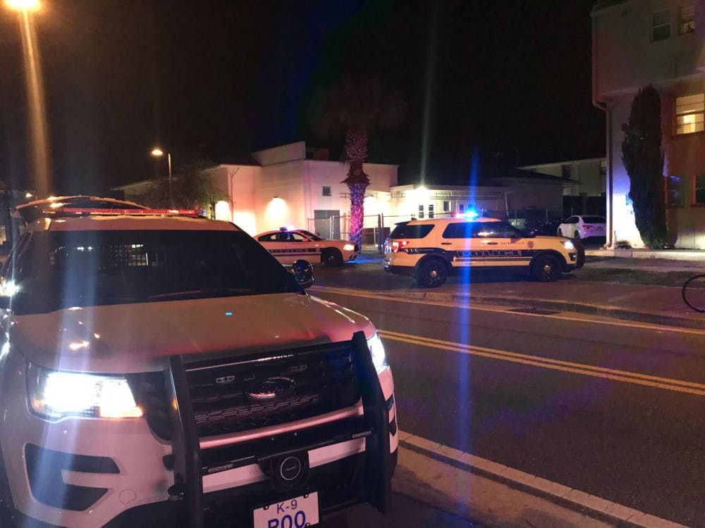 Gainesville Police cars parked outside of the apartment building and back of the Kappa Alpha Theta sorority house just after midnight Saturday.