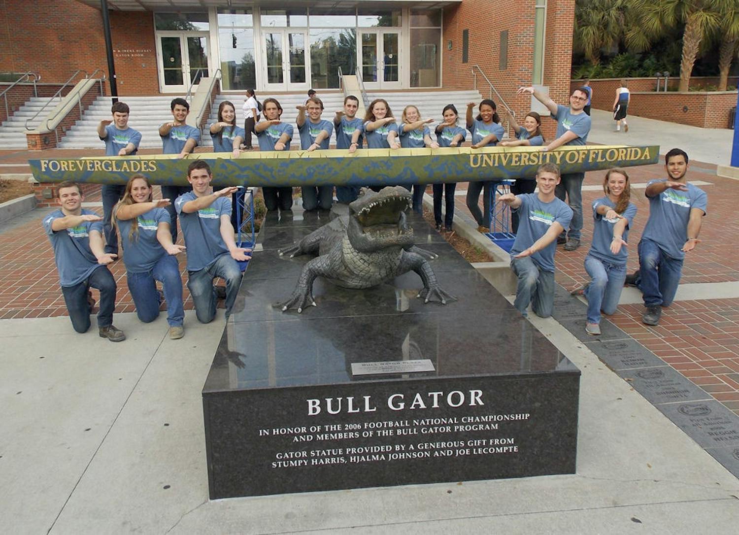 The UF Concrete Canoe team poses with the Bull Gator outside Ben Hill Griffin Stadium.