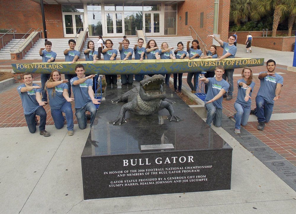 <p>The UF Concrete Canoe team poses with the Bull Gator outside Ben Hill Griffin Stadium.</p>