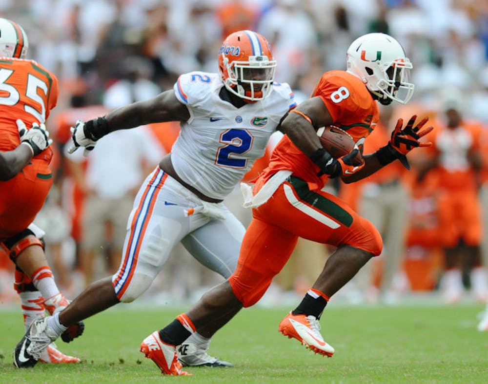 <p>Florida senior defensive tackle Dominique Easley (2) chases Miami running back Duke Johnson (8) during the Gators’ 21-16 loss to the Hurricanes on Sept. 7 in Sun Life Stadium. UF is No. 3 in the nation in total defense, allowing 208.5 yards per game this season.</p>