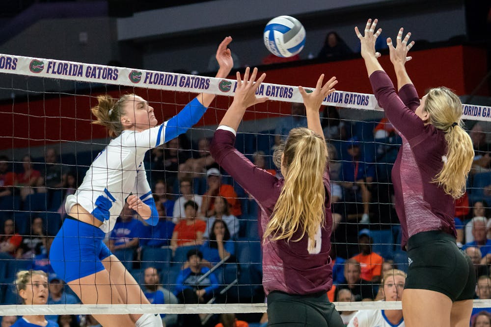 <p>Middle blocker Rachael Kramer (left) and the Gators front court held the Gamecocks to a .088 hitting percentage during the first two sets of Friday night's win. </p>