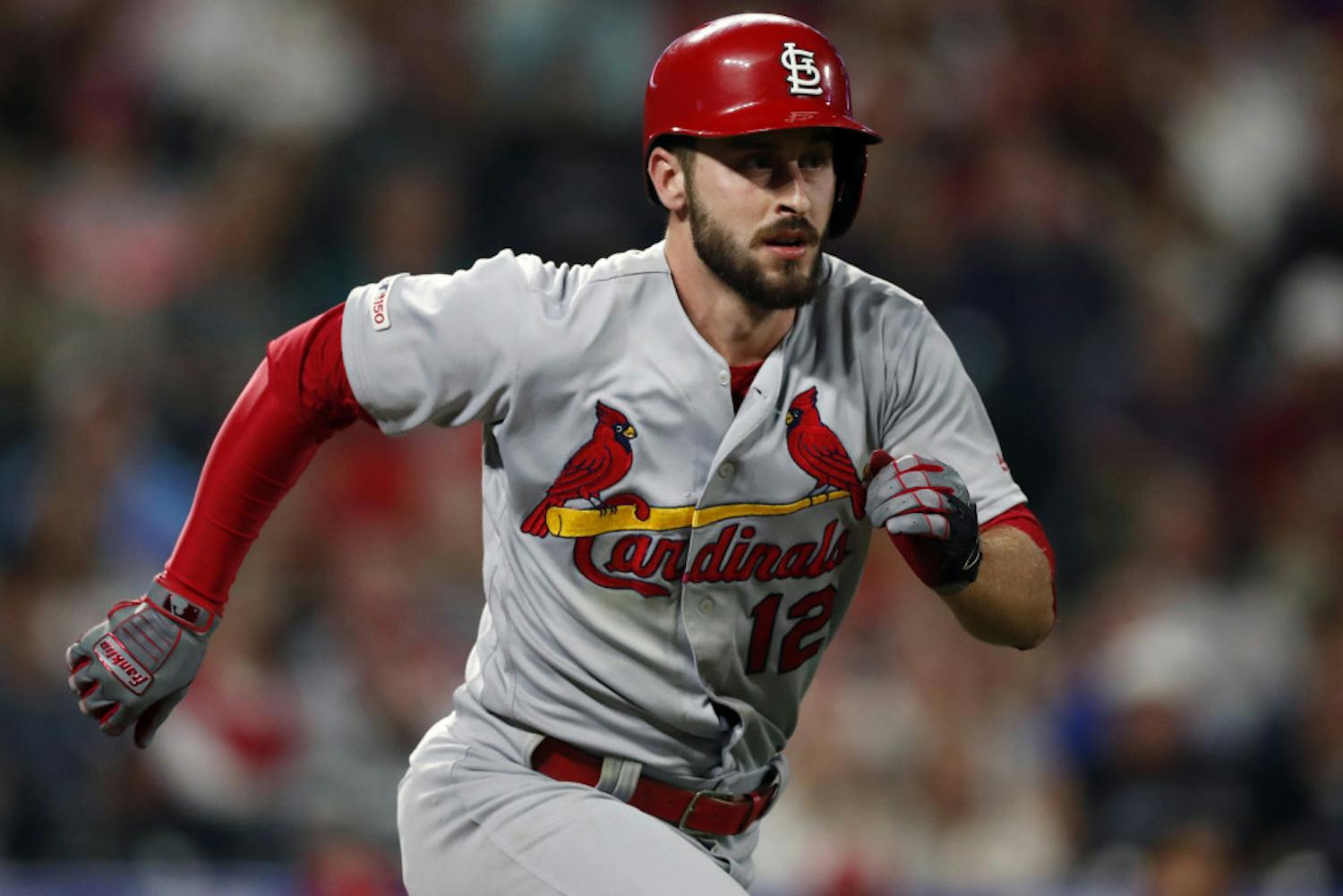 FILE - In this Sept. 10, 2019, file photo, St. Louis Cardinals shortstop Paul DeJong (12) runs the bases in the ninth inning of a baseball game against the St. Louis Cardinals in Denver. Reporters from The Associated Press spoke to more than two dozen athletes from around the globe -- representing seven countries and 11 sports -- to get a sense of how concerned or confident they are about resuming competition. Some wondered whether they would agree to receive a COVID-19 vaccine if required by their sport eventually. “I think it would stop at some sort of vaccine to play,” St. Louis Cardinals All-Star shortstop Paul DeJong said. “There is a fine line between what (MLB) can do to protect us and some things they can do to kind of exert power over us.”(AP Photo/David Zalubowski, File)
