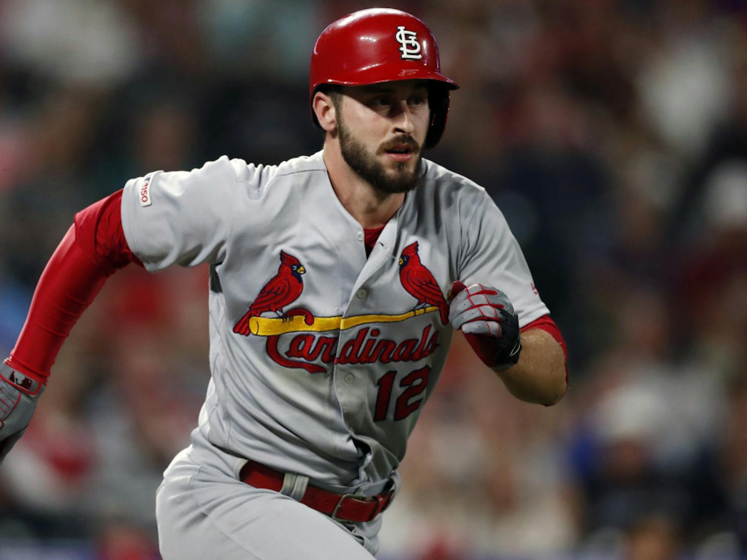 FILE - In this Sept. 10, 2019, file photo, St. Louis Cardinals shortstop Paul DeJong (12) runs the bases in the ninth inning of a baseball game against the St. Louis Cardinals in Denver. Reporters from The Associated Press spoke to more than two dozen athletes from around the globe -- representing seven countries and 11 sports -- to get a sense of how concerned or confident they are about resuming competition. Some wondered whether they would agree to receive a COVID-19 vaccine if required by their sport eventually. “I think it would stop at some sort of vaccine to play,” St. Louis Cardinals All-Star shortstop Paul DeJong said. “There is a fine line between what (MLB) can do to protect us and some things they can do to kind of exert power over us.”(AP Photo/David Zalubowski, File)