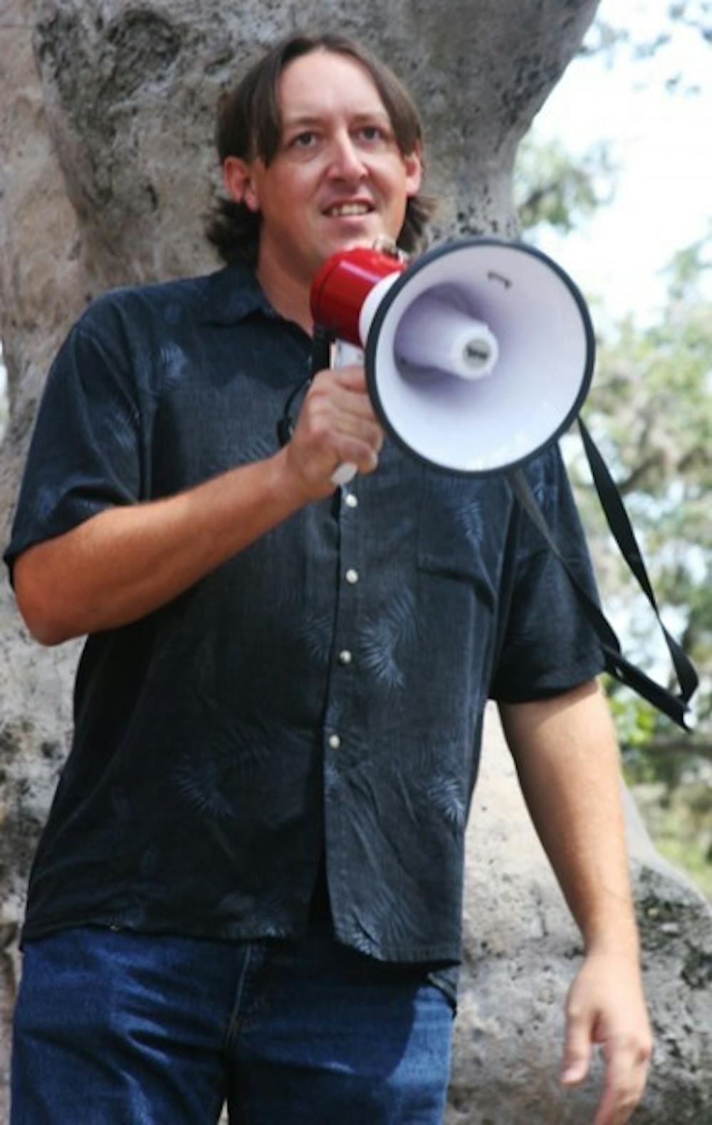 <p>James Ingle, a City Commission candidate for the at-large 1 seat, speaks to student activists at a protest on campus Friday.</p>