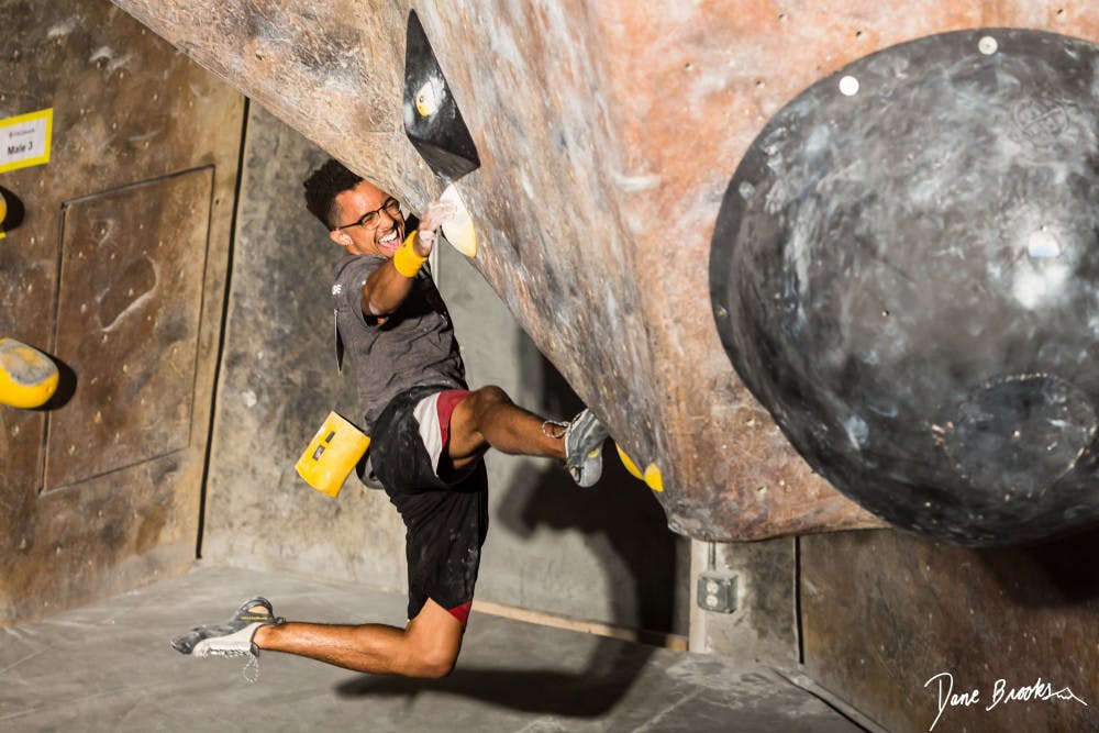 Michael Brown, 24, a friend of UF Rock Climbing Club head coach Dane Brooks, climbing at Mesa Rim Climbing Gym in San Diego, California. Brooks is one of many local climbers hoping to see The Knot, a possible new rock climbing gym, come to Gainesville. 
