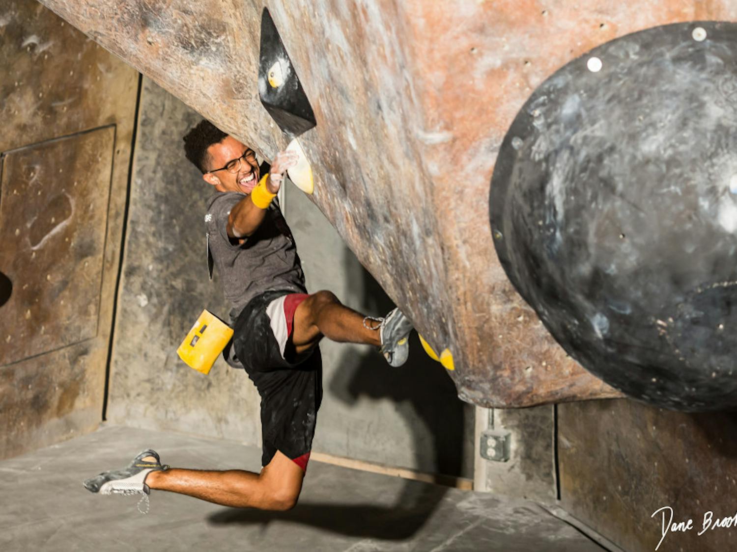 Michael Brown, 24, a friend of UF Rock Climbing Club head coach Dane Brooks, climbing at Mesa Rim Climbing Gym in San Diego, California. Brooks is one of many local climbers hoping to see The Knot, a possible new rock climbing gym, come to Gainesville. 