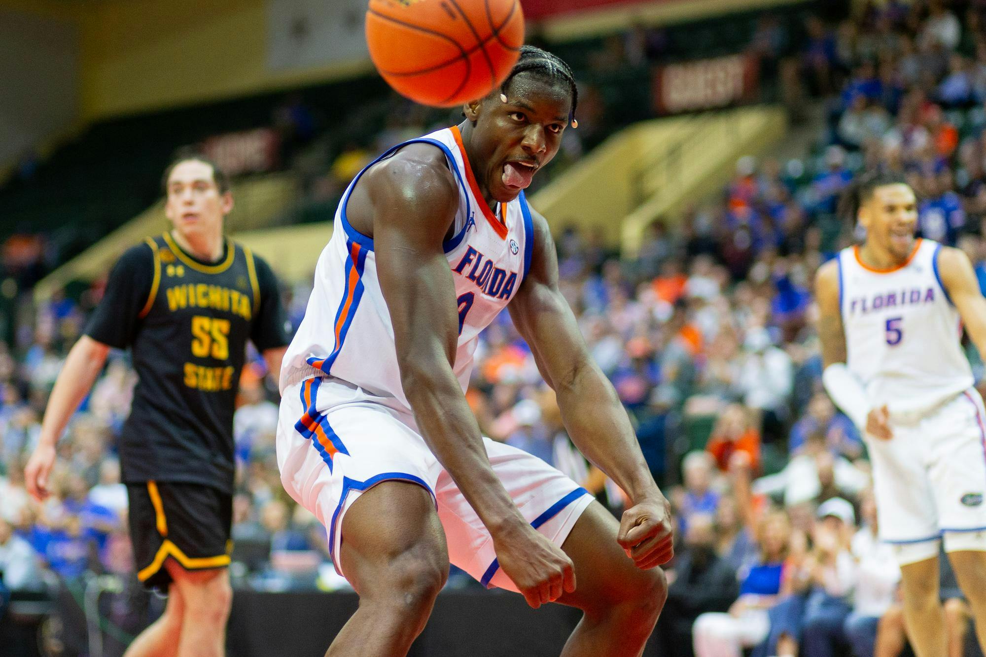 Florida Gators Center Rueben Chinyelu (9) flexes after dunking the ball during the second half against the Wichita State Shockers at State Farm Field House on Friday, Nov. 29, 2024.