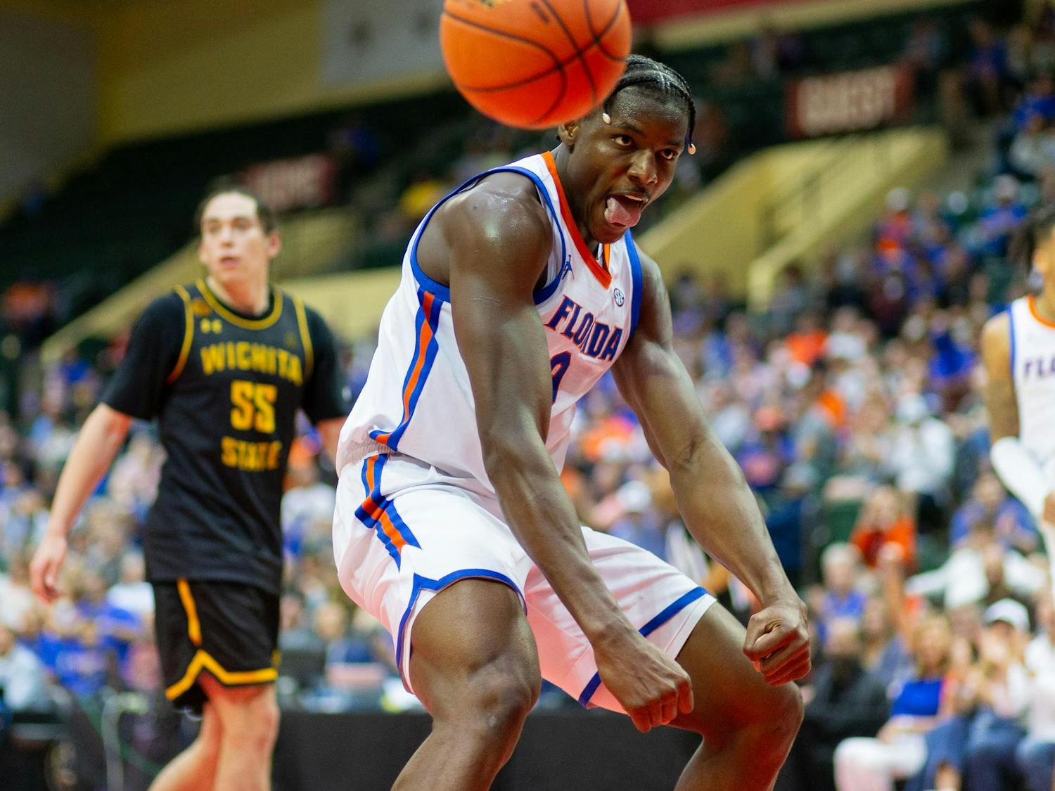 Florida Gators Center Rueben Chinyelu (9) flexes after dunking the ball during the second half against the Wichita State Shockers at State Farm Field House on Friday, Nov. 29, 2024.