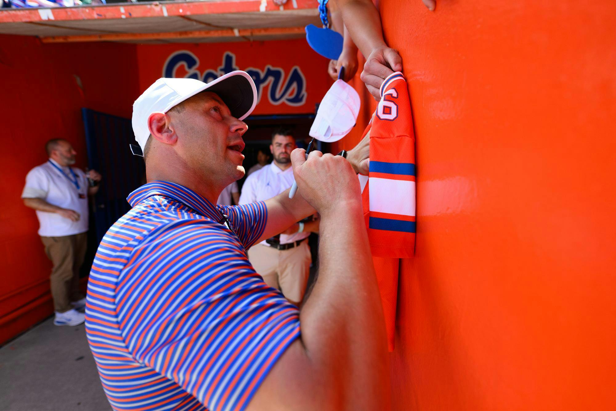 Florida head coach Jon Sumrall signs a jersey after the Orange & Blue spring football game, Saturday, April 11, 2026, in Gainesville, Fla.