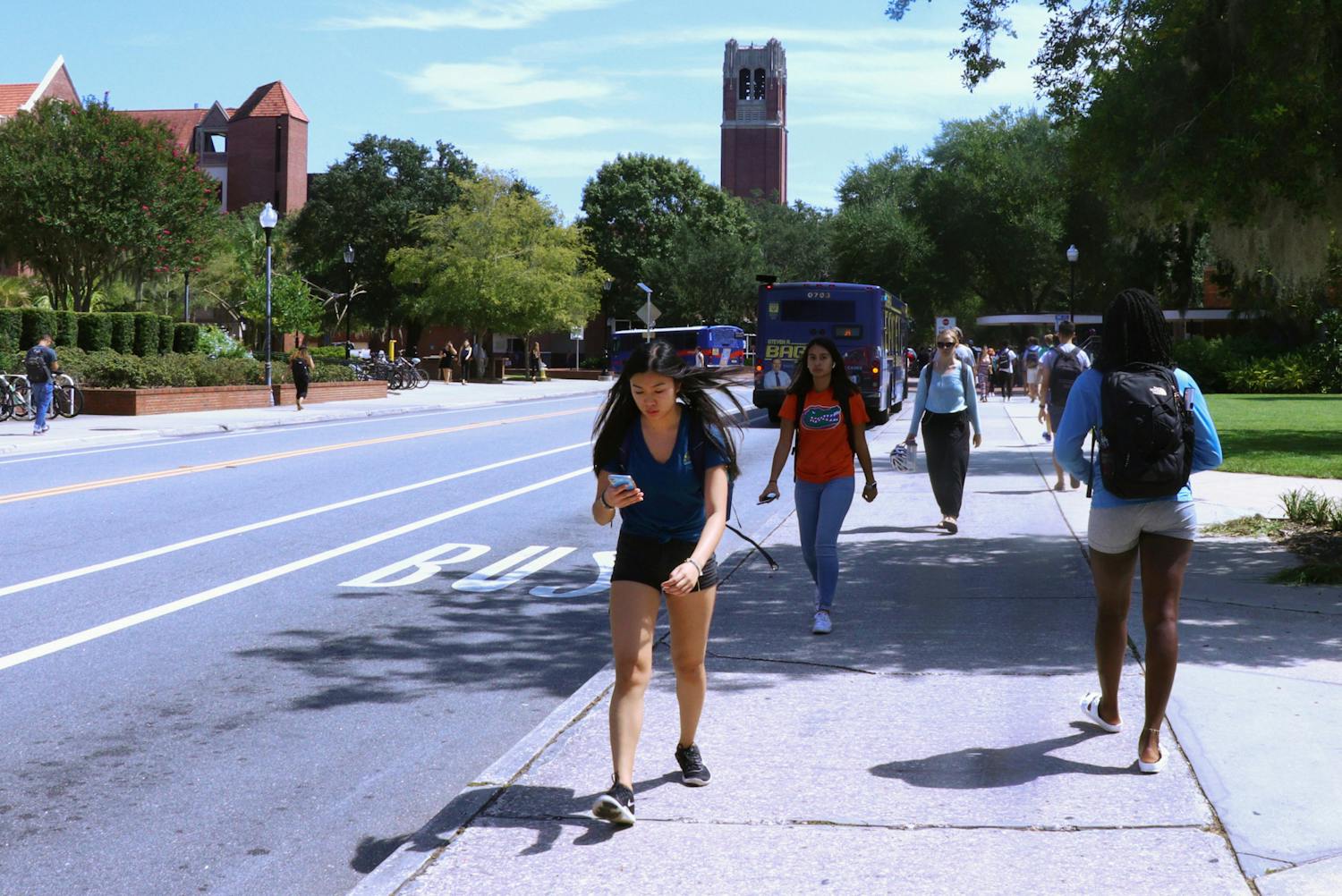 University of Florida students rush to and from class along Stadium Road prior to the pandemic, on September 17, 2019. The upcoming fall semester will see tens of thousands of students return to campus, although an increase in the number of delta variant COVID-19 infections raises concerns about viral spread among unvaccinated people.