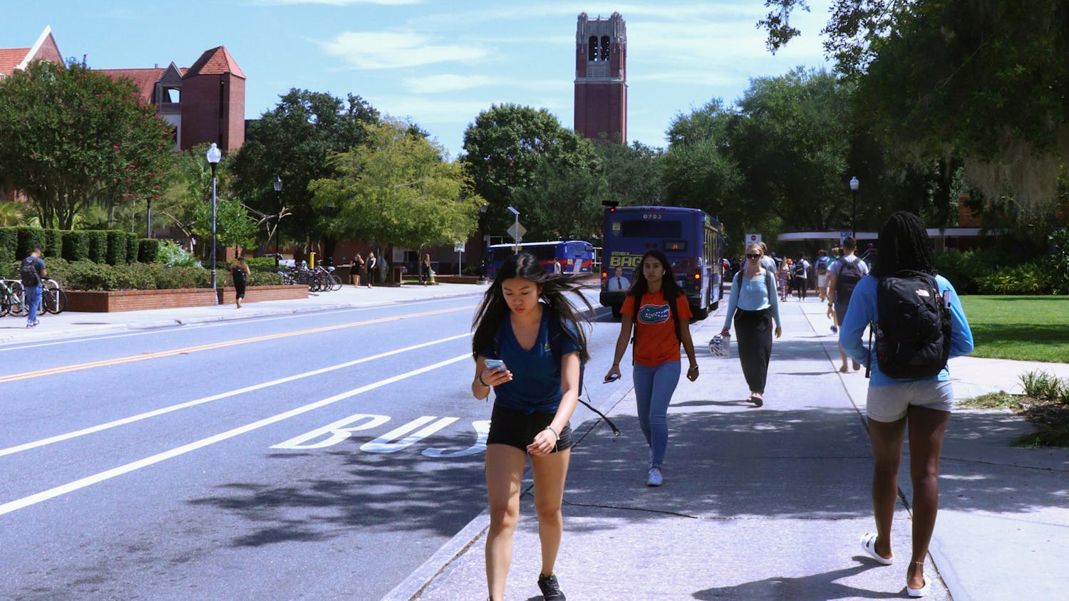 University of Florida students rush to and from class along Stadium Road prior to the pandemic, on September 17, 2019. The upcoming fall semester will see tens of thousands of students return to campus, although an increase in the number of delta variant COVID-19 infections raises concerns about viral spread among unvaccinated people.