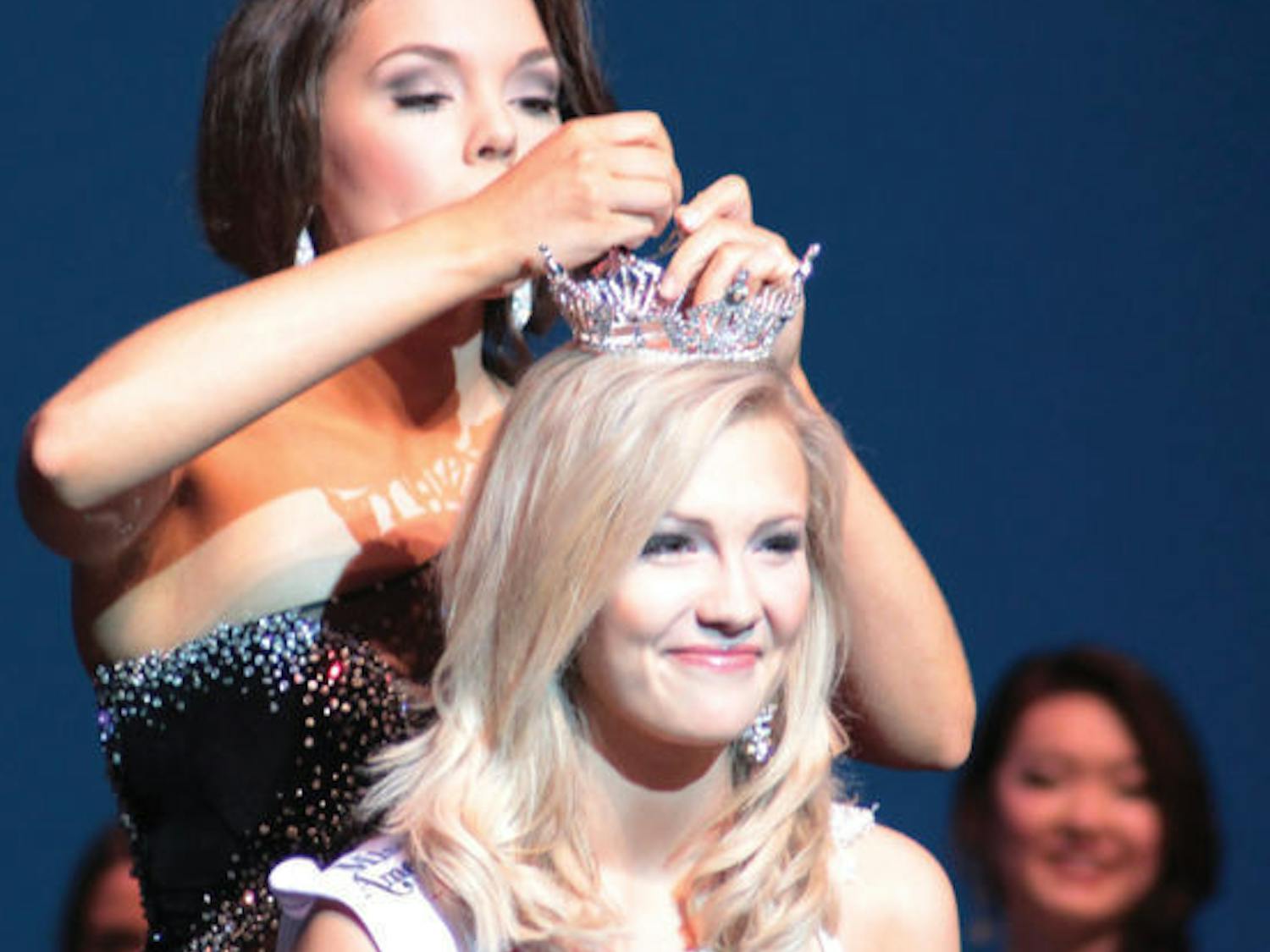 Telecommunication sophomore Elizabeth Fechtel is crowned Miss UF 2014 at the Curtis M. Phillips Center for the Performing Arts on Monday night.