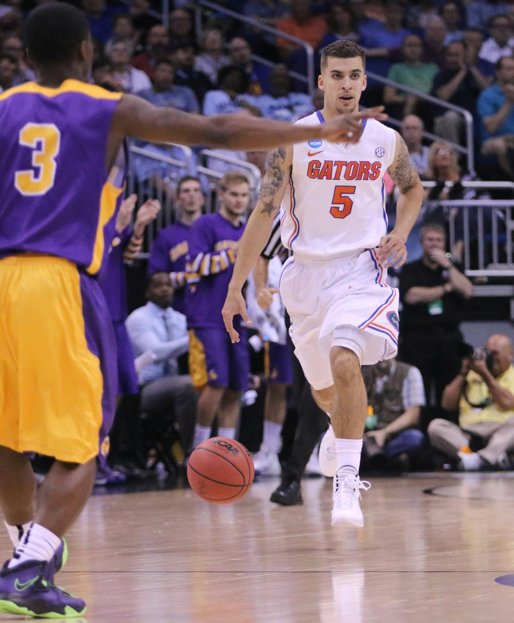 Scottie Wilbekin drives down the court during UF’s 67-55 win against Albany on Thursday in Orlando.