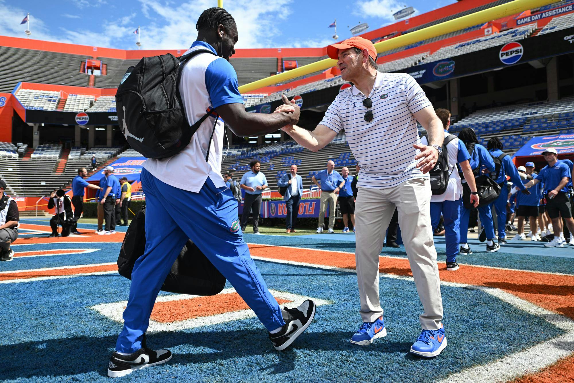 Florida running back Jadan Baugh (left) shakes hands with Secretary of State Marco Rubio (right) before an NCAA college football game against Campbell, Saturday, Sept. 12, 2026, in Gainesville, Fla.