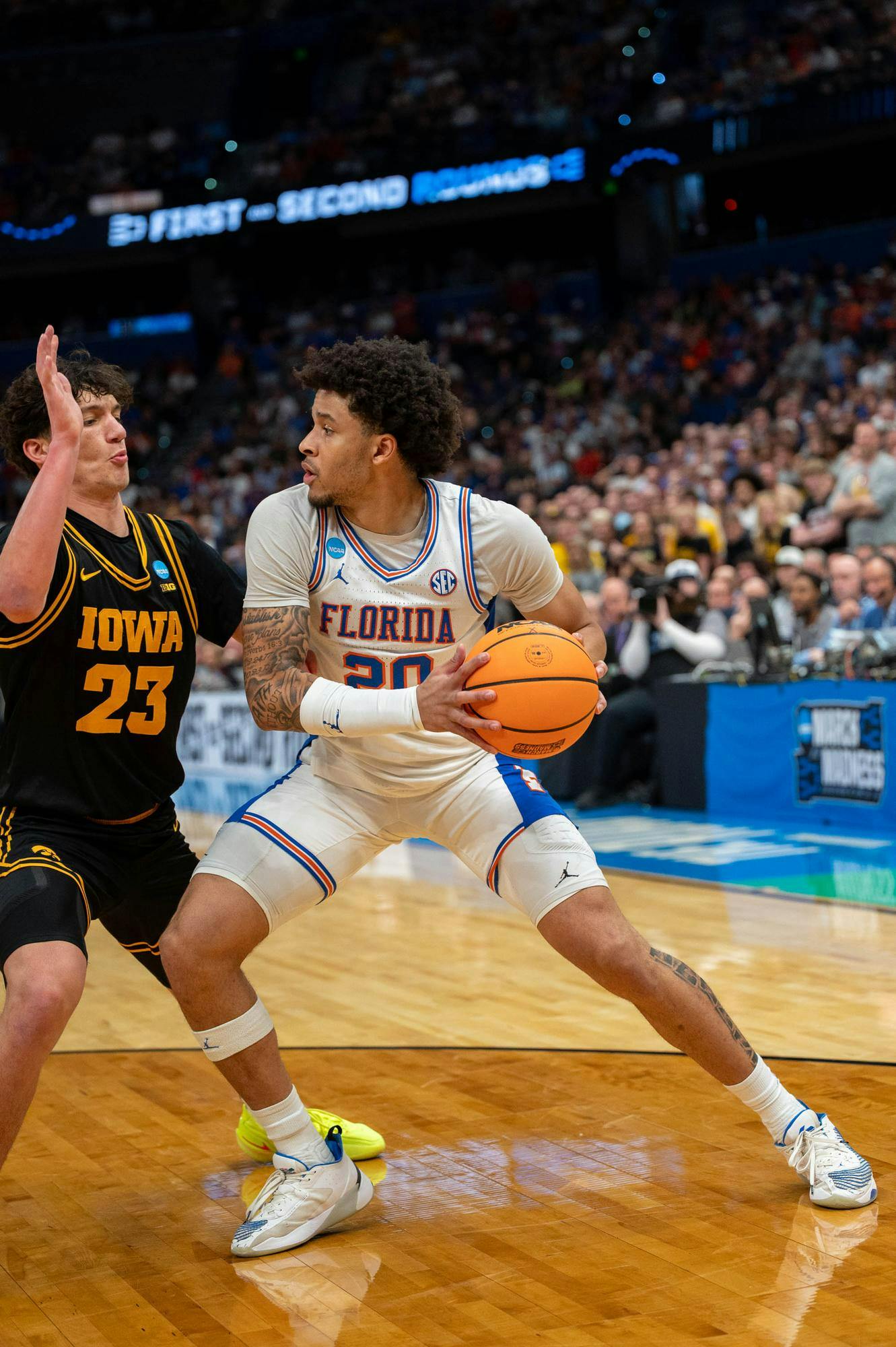 Florida guard Isaiah Brown (20) looks for a lane during the second half of an NCAA Tournament second round game against Iowa, Sunday, March 22, 2026, in Tampa, Fla.