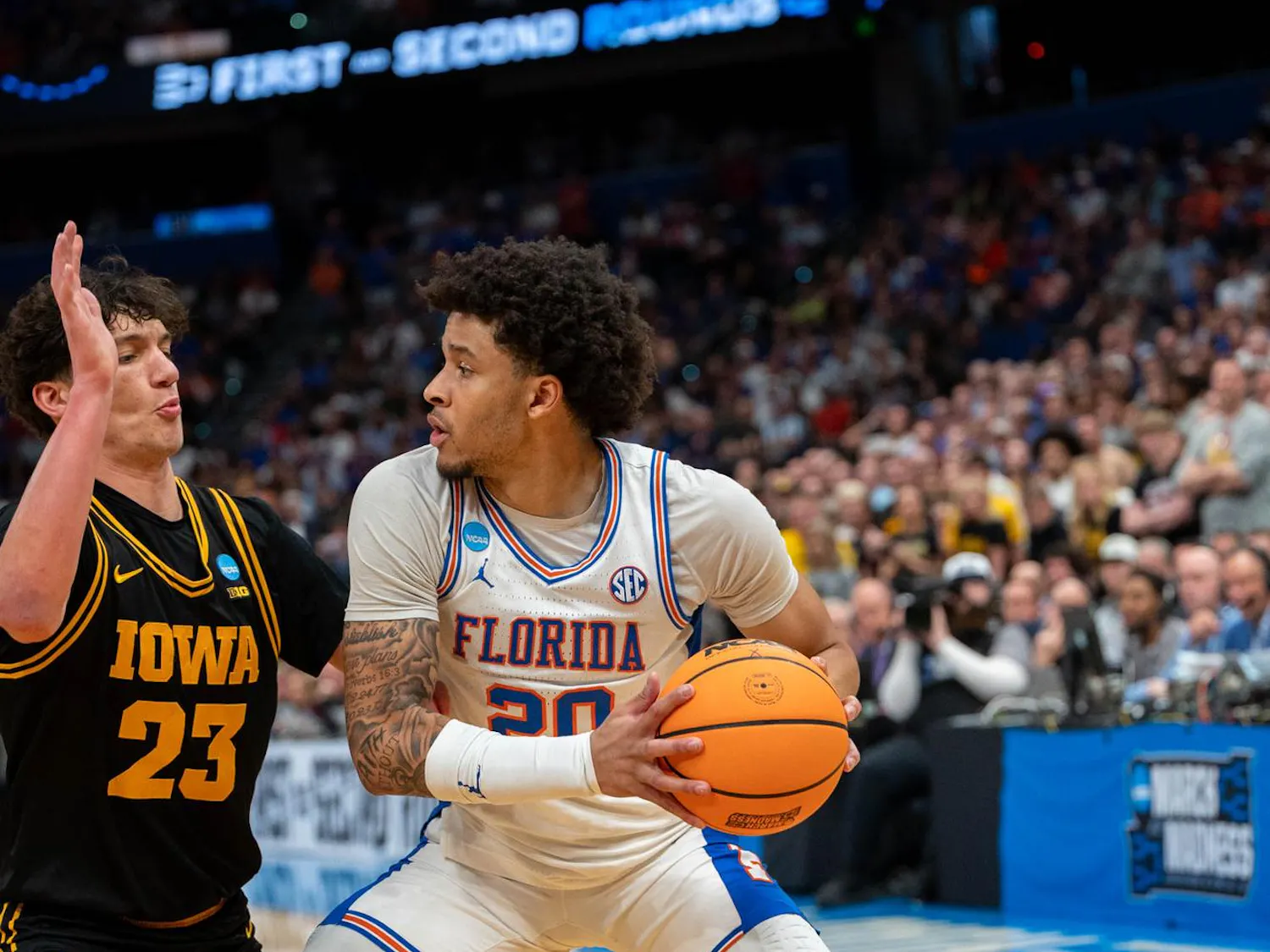Florida guard Isaiah Brown (20) looks for a lane during the second half of an NCAA Tournament second round game against Iowa, Sunday, March 22, 2026, in Tampa, Fla.