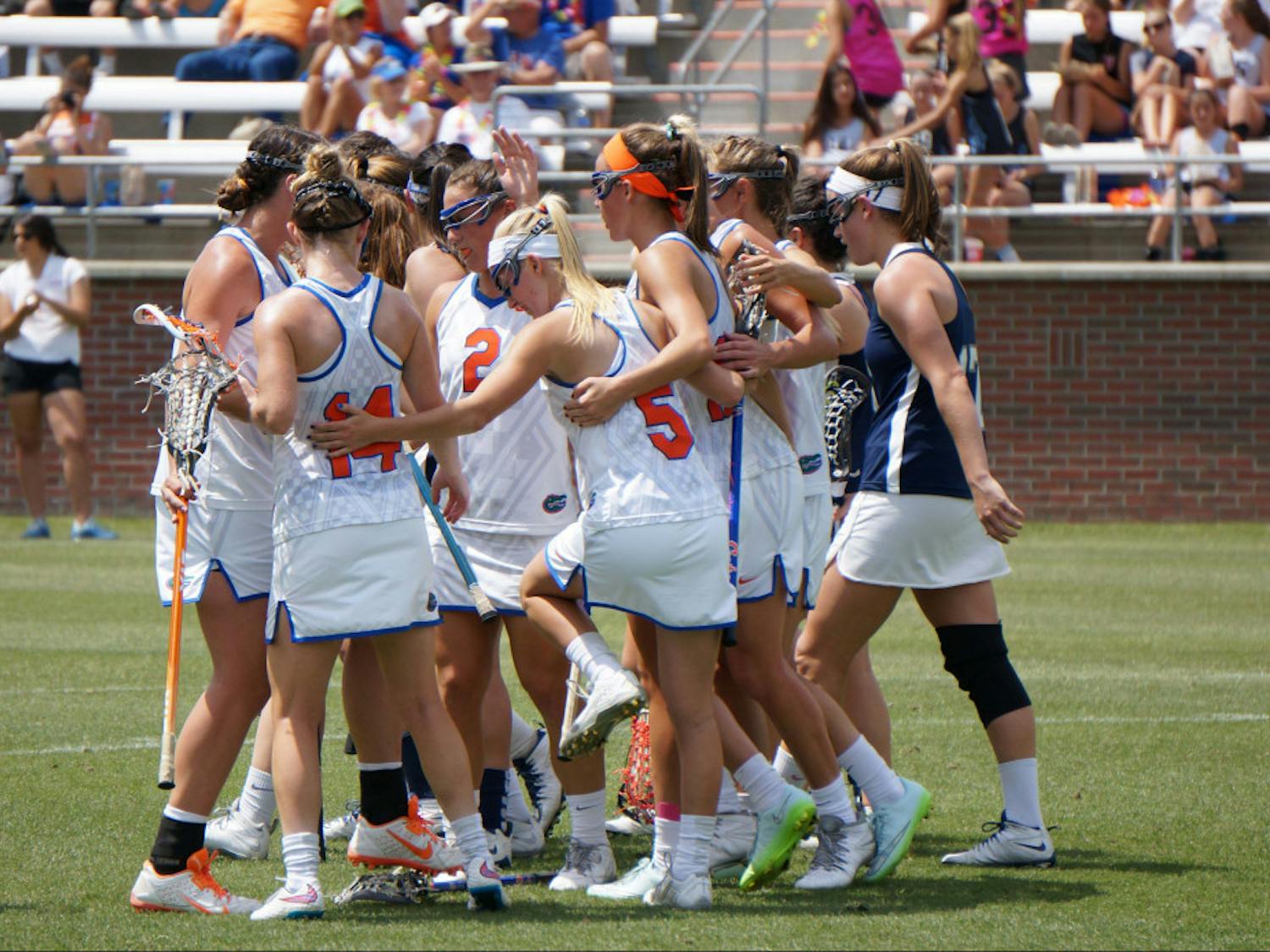 Florida lacrosse players celebrate after a goal during UF's 18-4 win against Georgetown on April 4 at Donald R. Dizney Stadium.