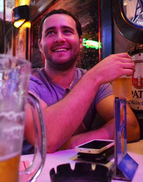 Senior Alex Solomon, enjoys a beer at Salty Dog Saloon before his class.