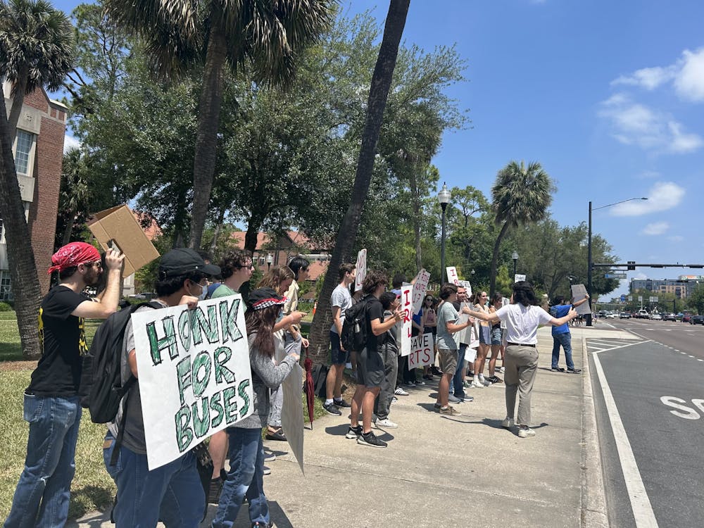 <p>A crowd of protestors gathered in front of Tigert Hall to advocate for RTS funding on Friday, April 26, 2024.</p>