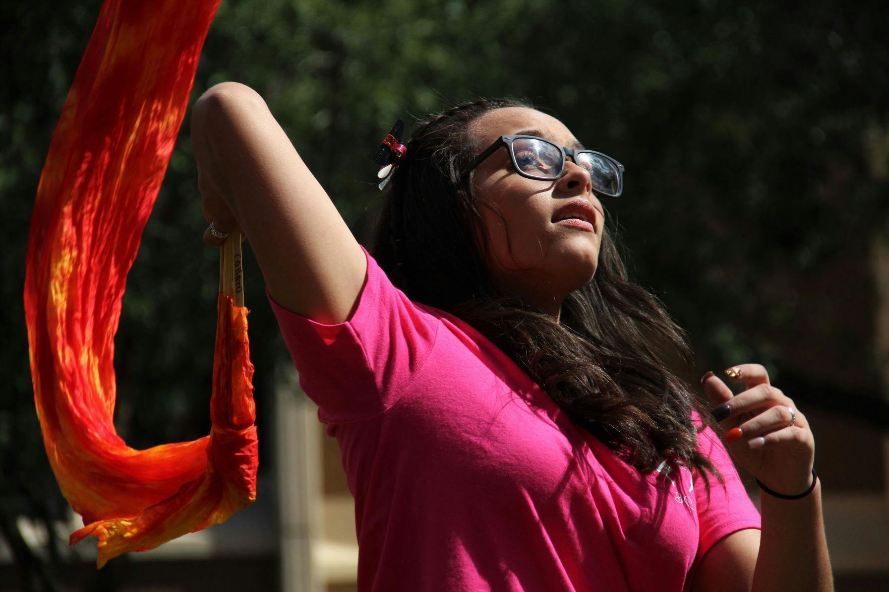Carla Collazo, a 16-year-old from Puerto Rico, leads her veiled-fan dance group for Iglesia Casa Del Alfarero, or Potter's House Church, during the Downtown Latino Festival in Bo Diddley Plaza Saturday afternoon.
&nbsp;
