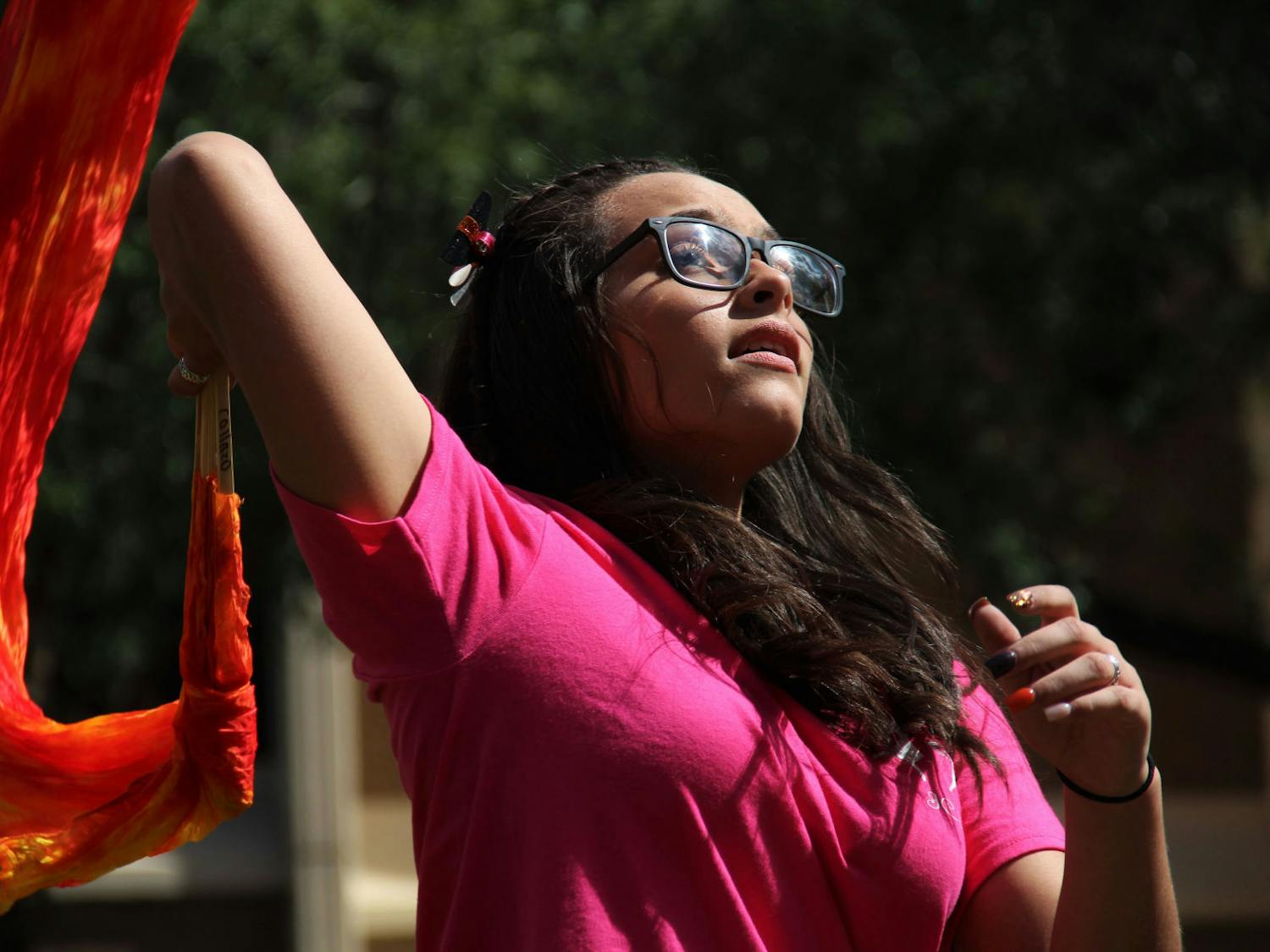Carla Collazo, a 16-year-old from Puerto Rico, leads her veiled-fan dance group for Iglesia Casa Del Alfarero, or Potter's House Church, during the Downtown Latino Festival in Bo Diddley Plaza Saturday afternoon.
&nbsp;