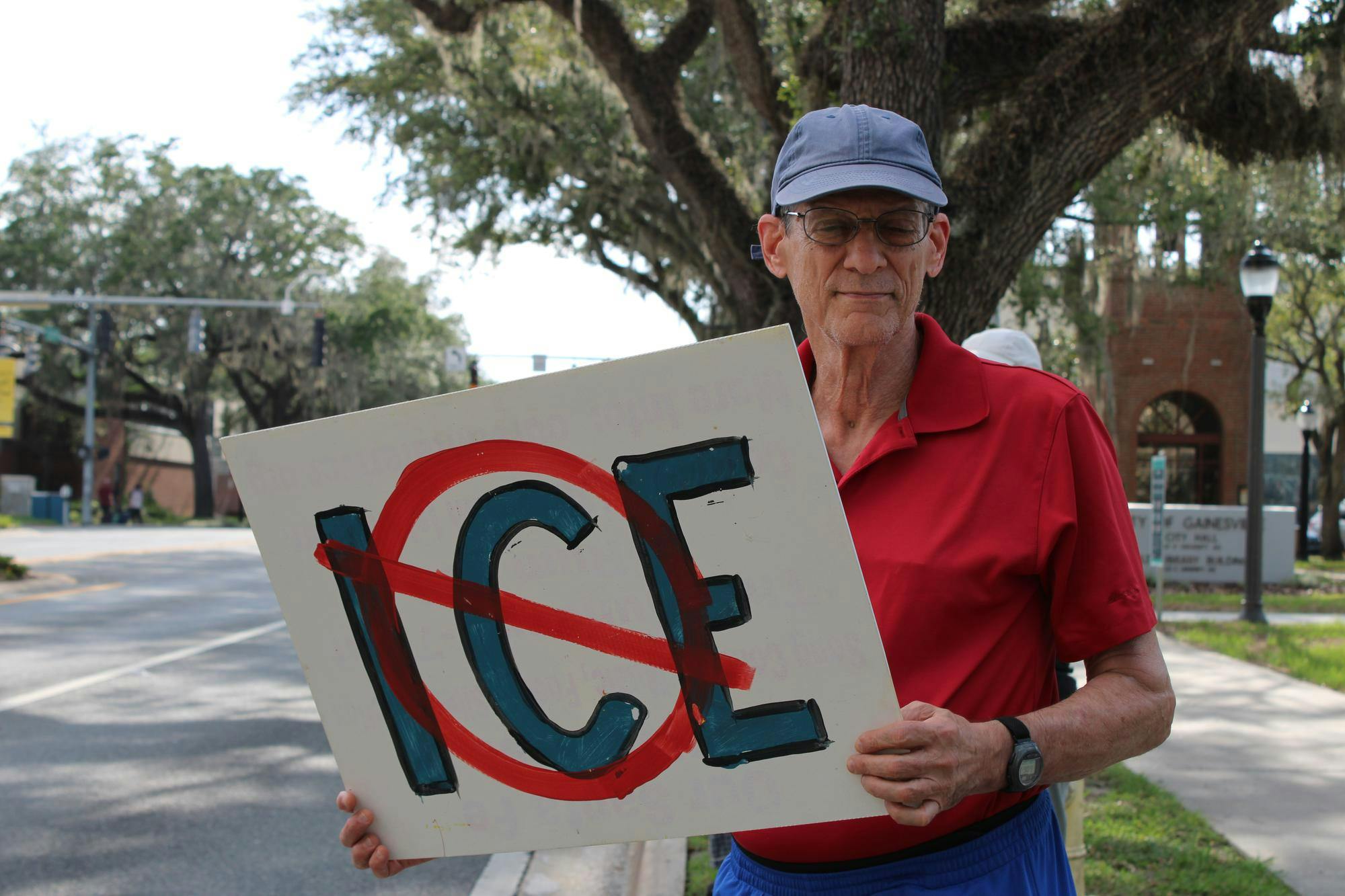 Gainesville residents gather at Gainesville City Hall for a protest and vigil honoring victims of ICE and police violence, Saturday, July 25, 2026.
