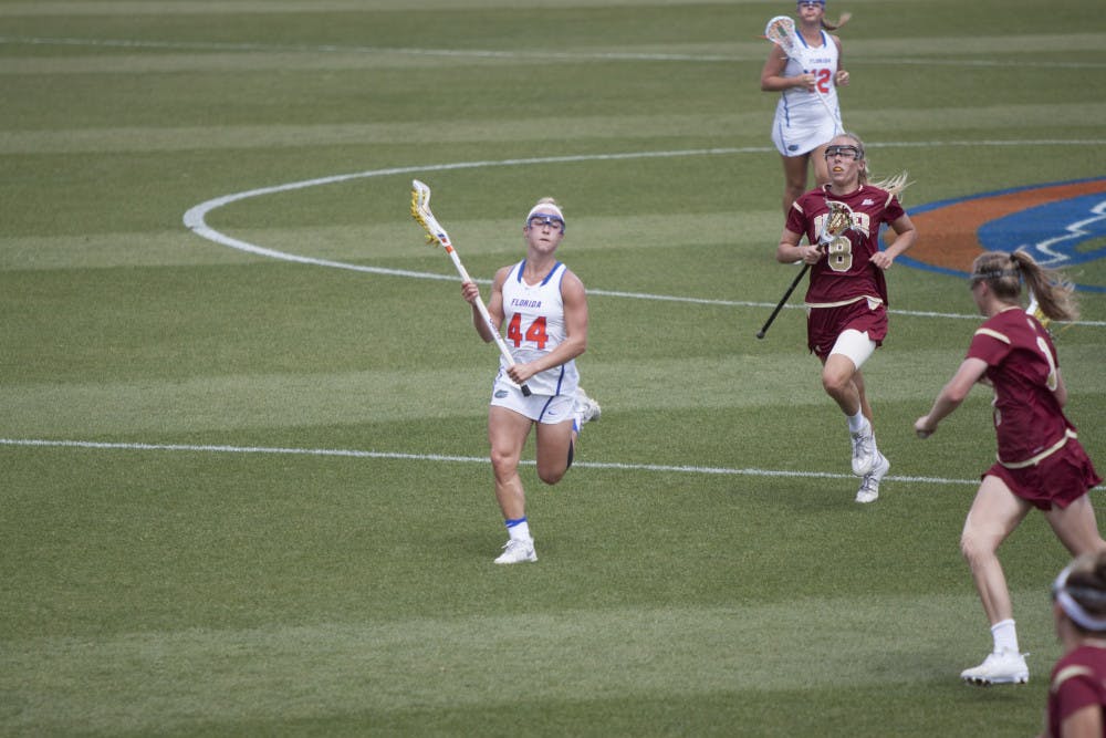 UF midfielder Sydney Pirreca runs downfield with the ball during Florida's 15-8 win against Denver on March 25, 2017, at Donald R. Dizney Stadium.