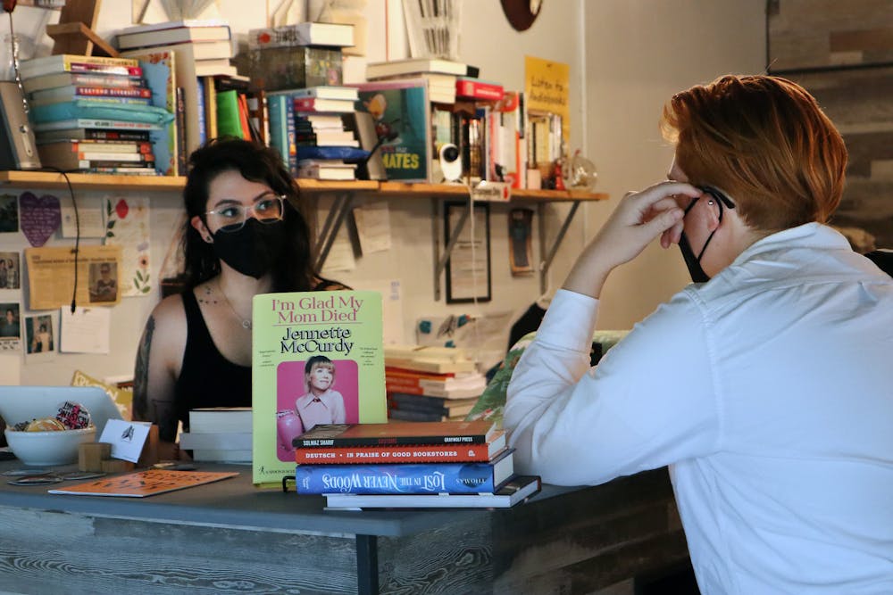 <p>Heather Halak greets a customer inside Third House Books. ﻿</p>
