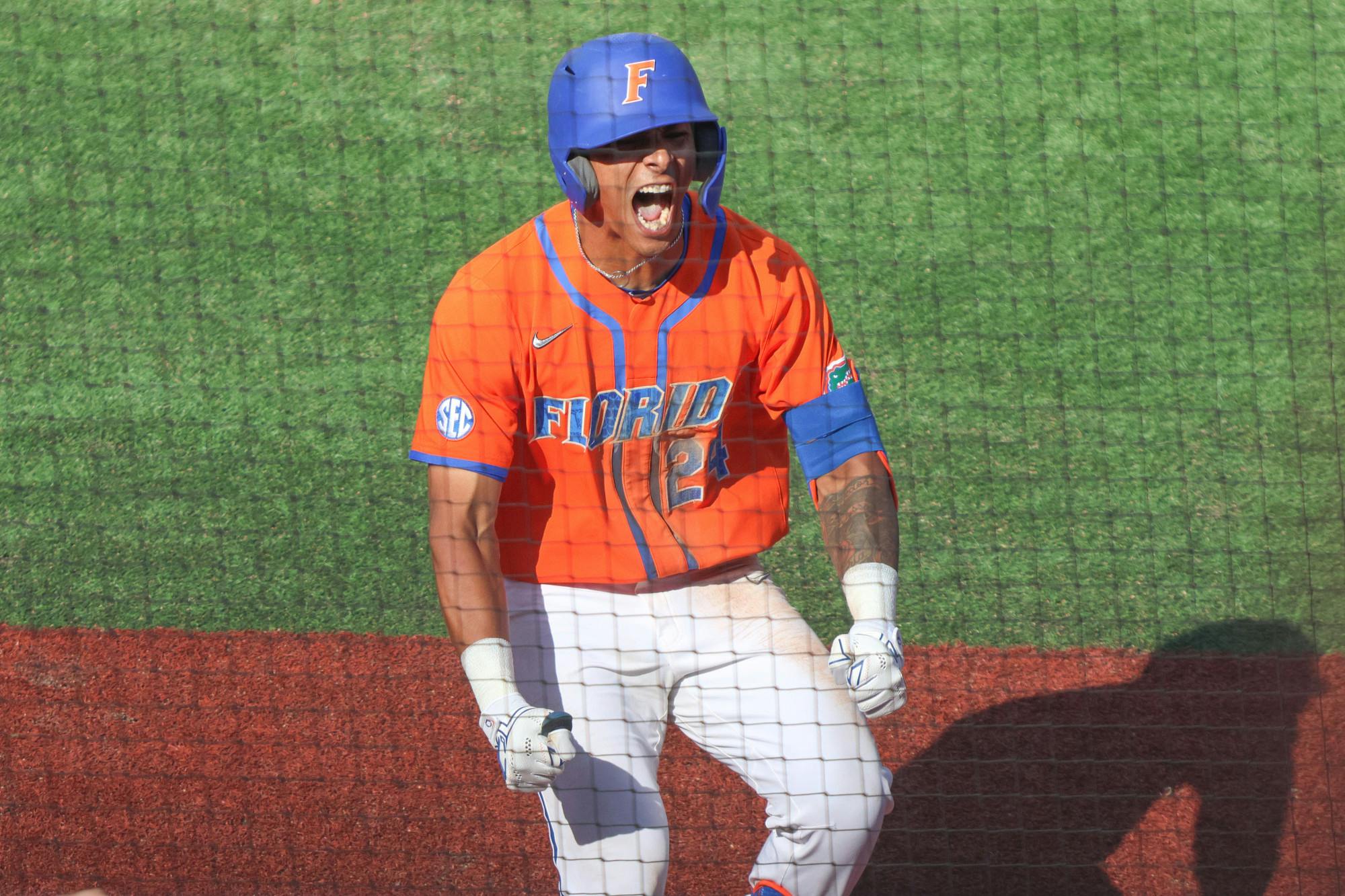 Florida shortstop Josh Rivera celebrates a run during the Gators' 13-7 win against Cincinnati Bearcats Sunday, Feb. 26, 2023.