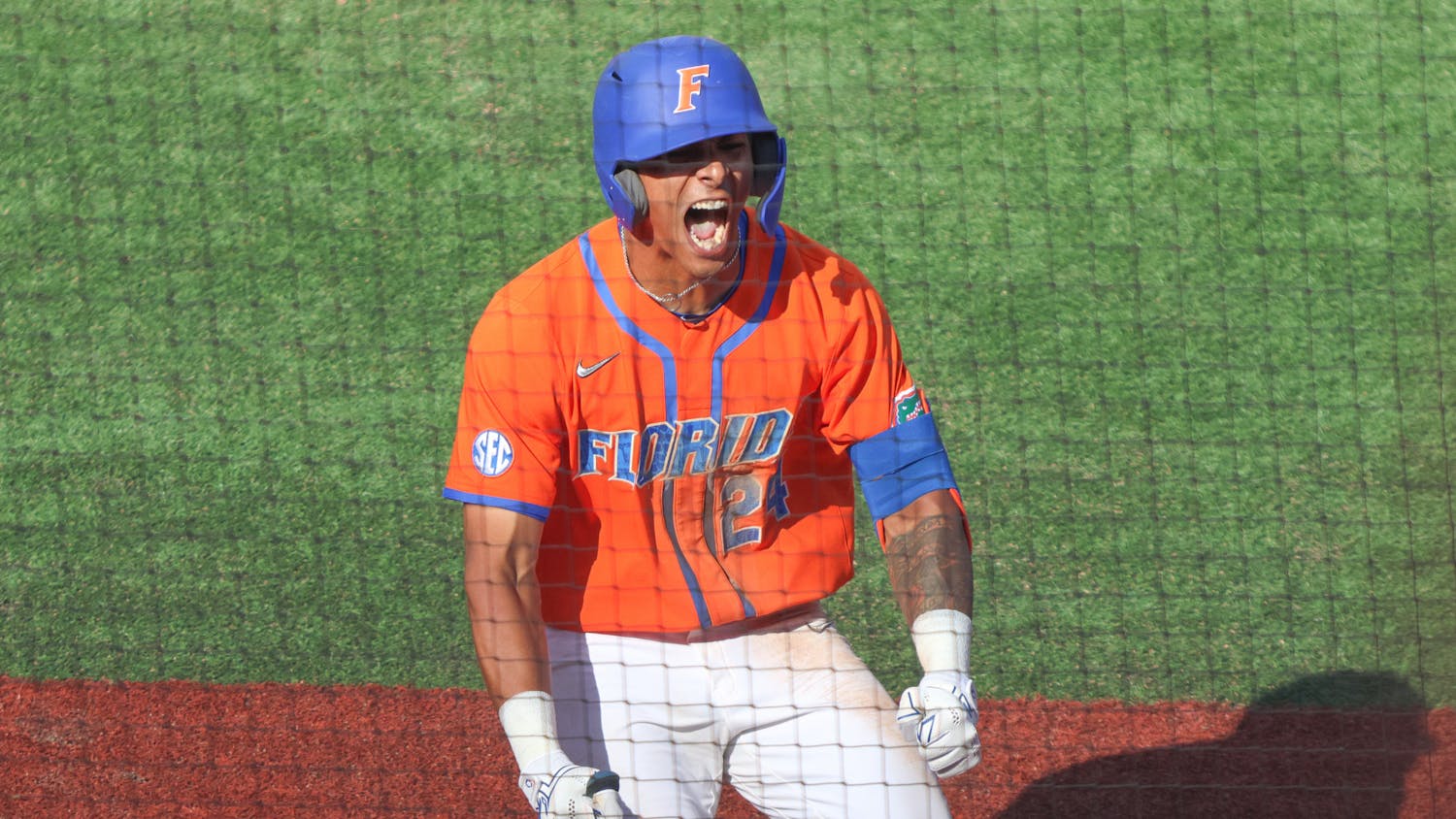 Florida shortstop Josh Rivera celebrates a run during the Gators' 13-7 win against Cincinnati Bearcats Sunday, Feb. 26, 2023.