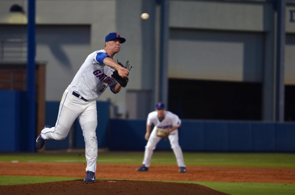 UF's Logan Shore pitches during Florida's 14-3 win against the South Carolina Gamecocks on April 11, 2015 at McKethan Stadium.