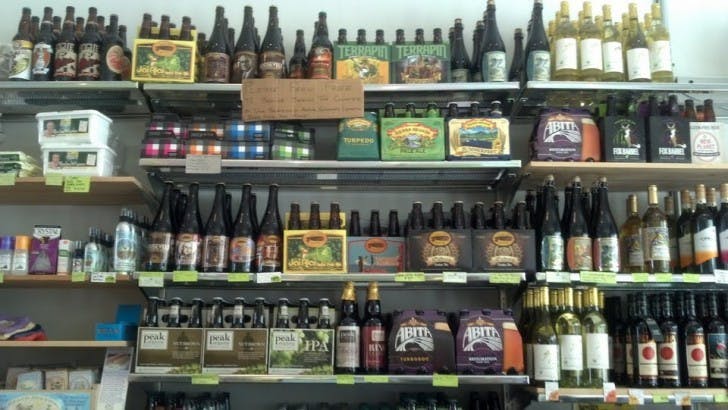 Filling five shelves right behind the checkout counter, the co-op’s beer, wine and cider collection is a welcome sight to beer lovers who also want to help support the local economy.