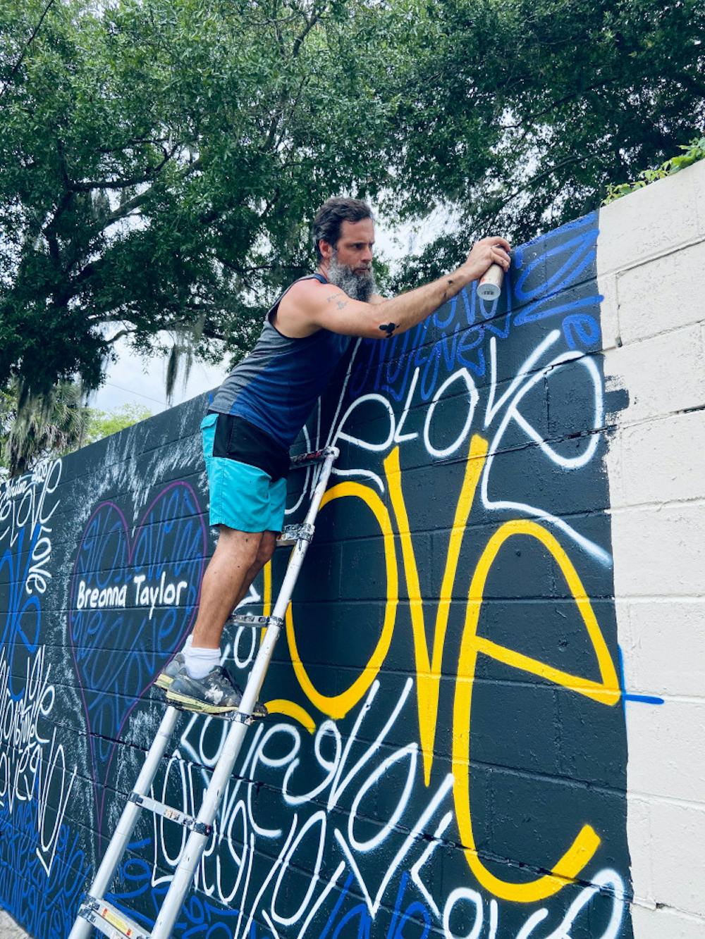<p><span>Artist Renda Writer painted a mural in honor of Breonna Taylor Friday as part of the Fifth Avenue Wall at Springhill project. </span></p>