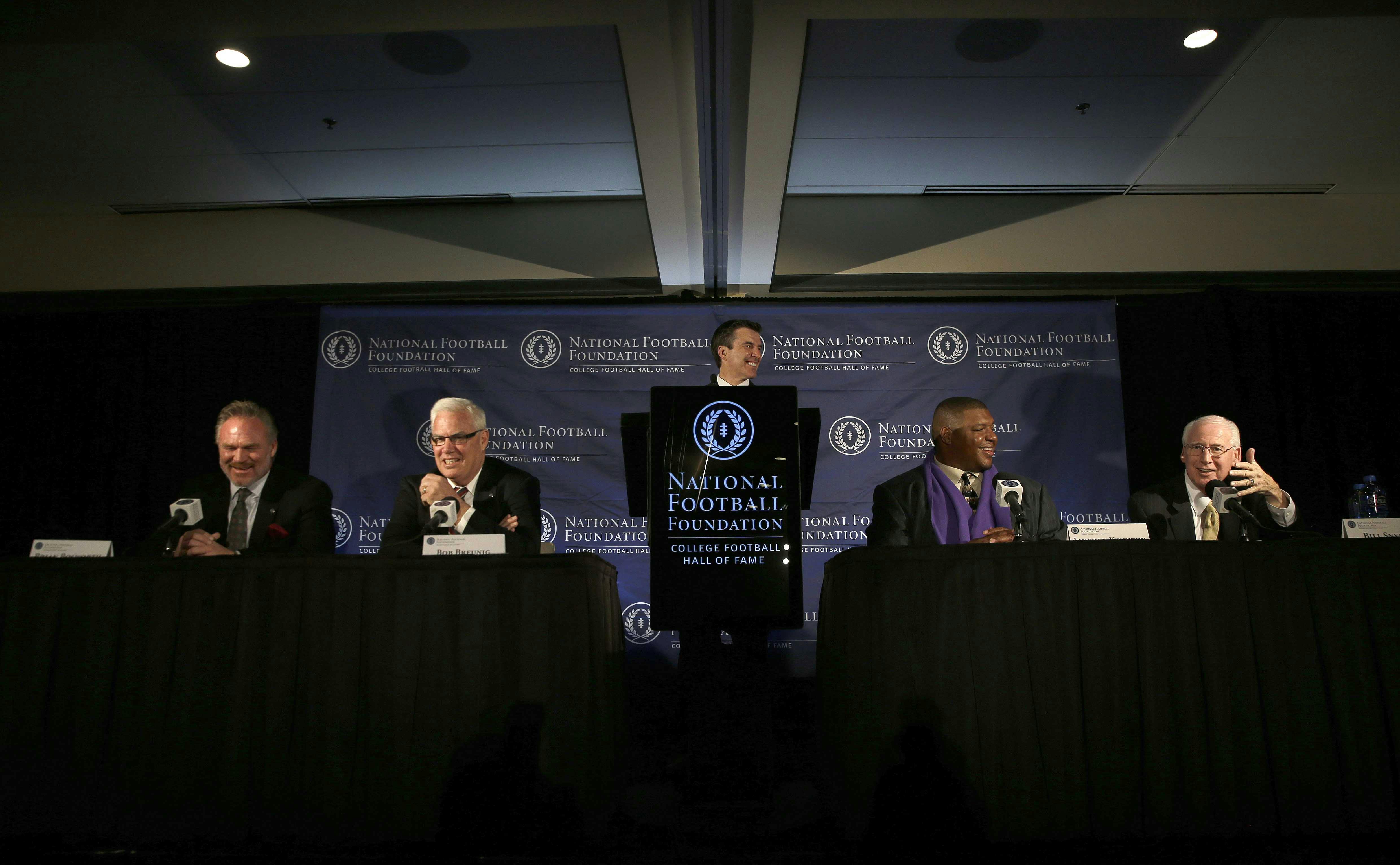 Kansas State head football coach Bill Snyder, right, speaks as from left, Brian Bosworth, Bob Breunig, Reese Davis and Lincoln Kennedy laugh during a news conference announcing the 2015 College Football Hall of Fame Class on Jan. 9, 2015, in Dallas.