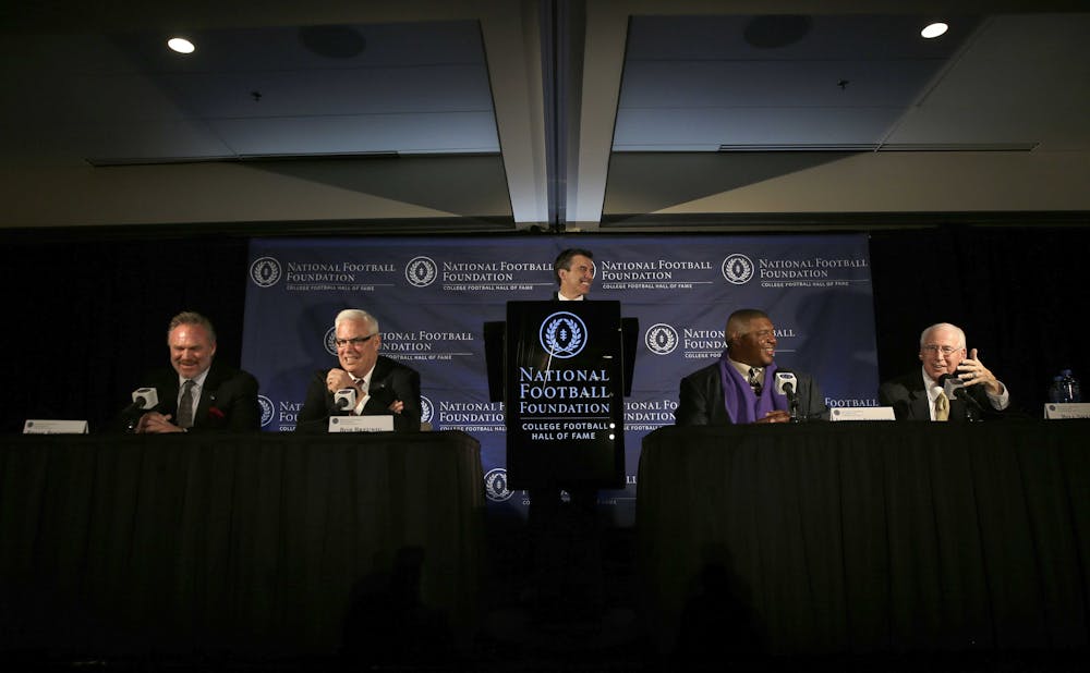 <p>Kansas State head football coach Bill Snyder, right, speaks as from left, Brian Bosworth, Bob Breunig, Reese Davis and Lincoln Kennedy laugh during a news conference announcing the 2015 College Football Hall of Fame Class on Jan. 9, 2015, in Dallas.</p>