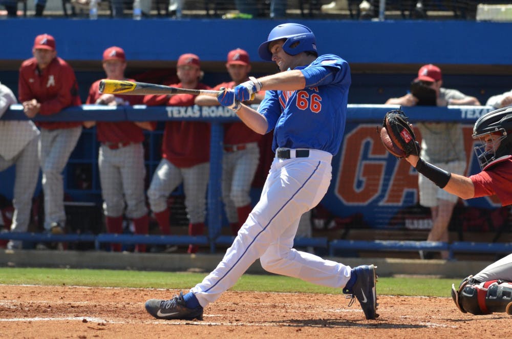 UF's Ryan Larson follows through on a swing during the Florida Gators' 7-4 win against the Alabama Crimson Tide on March 28, 2015, at McKethan Stadium in Gainesville, Florida.