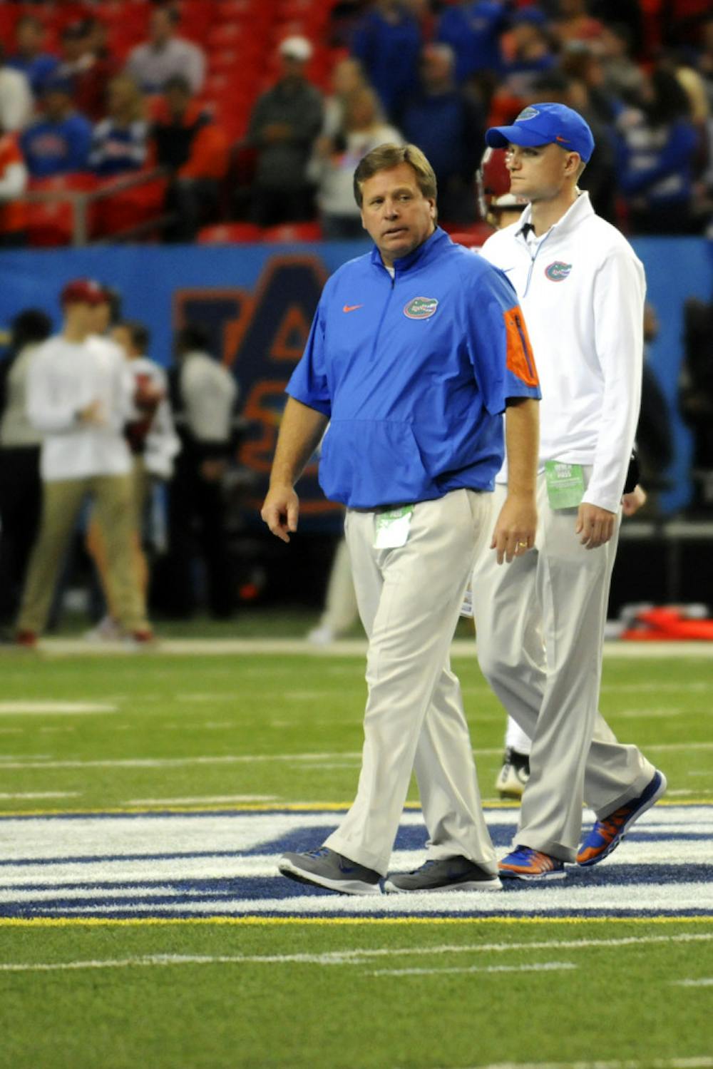 <p>Jim McElwain looks on during Florida's 29-15 loss to Alabama in the 2015 SEC Championship Game.</p>