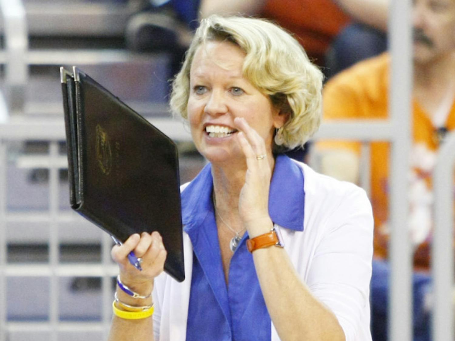 Florida coach Mary Wise claps during a 3-0 win against FIU on Aug. 24, 2012 in the O'Connell Center.
