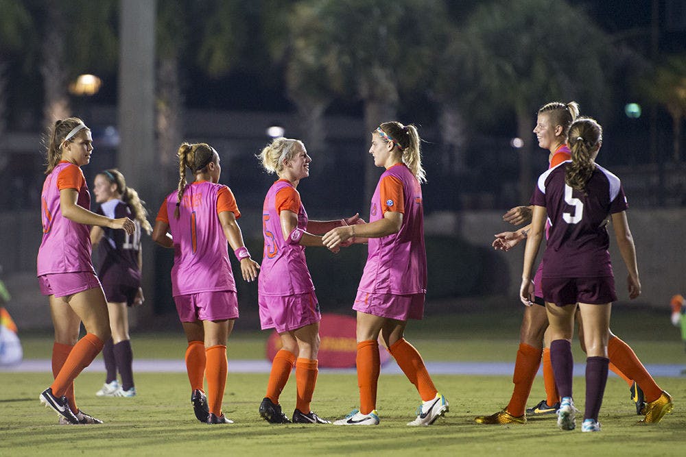 Tessa Andujar (15) congratulates Savannah Jordan (7) after Jordan's second goal during Florida's 5-1 win against Mississippi State on Friday night at James G. Pressly Stadium.