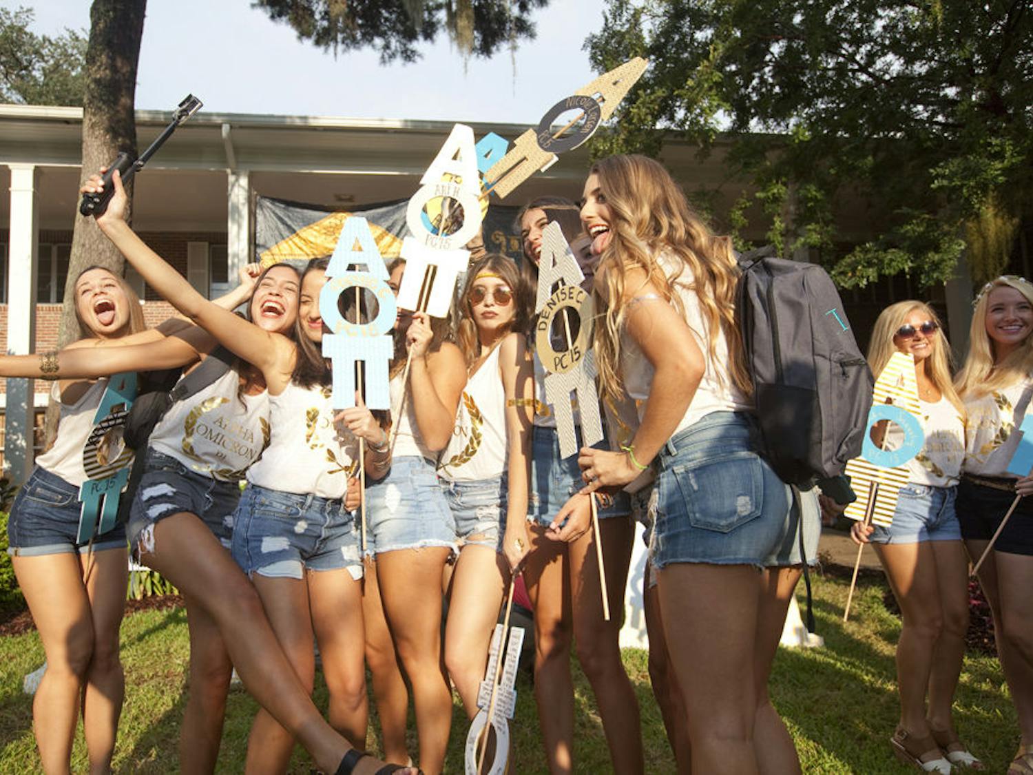 High heels clacked against wet sidewalks as smiling girls rushed to their new houses. The drizzling Florida rain stopped Wednesday evening, allowing the sun to spotlight the new recruits on sorority row during Bid Day. These new members have been rushing since last Wednesday. After three rounds of recruitment and a preferential round, sororities finally revealed which girls were given "bids." During this process, more than 1,700 girls visited each sorority house in hopes of finding their perfect match, feeling out which group of girls they could potentially call sisters.