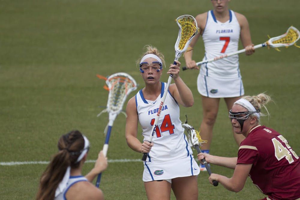 <p>UF attacker Lindsey Ronbeck holds her stick up during Florida's 15-8 win against Denver on March 25, 2017, at Donald R. Dizney Stadium.</p>