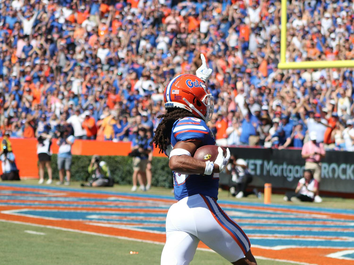 Florida redshirt sophomore cornerback Jaydon Hill returns his first career interception 49 yards for a touchdown in the first quarter of the Gators' win over the Missouri Tigers Saturday, Oct. 8, 2022. 