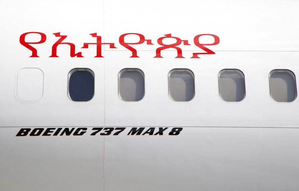 <p>An Ethiopian Airlines Boeing 737 Max 8 sits grounded at Bole International Airport in Addis Ababa, Ethiopia Saturday, March 23, 2019. The chief of Ethiopian Airlines says the warning and training requirements set for the now-grounded 737 Max aircraft may not have been enough following the Ethiopian Airlines plane crash that killed 157 people. Writing in Amharic reads "Ethiopian". (AP Photo/Mulugeta Ayene)</p>