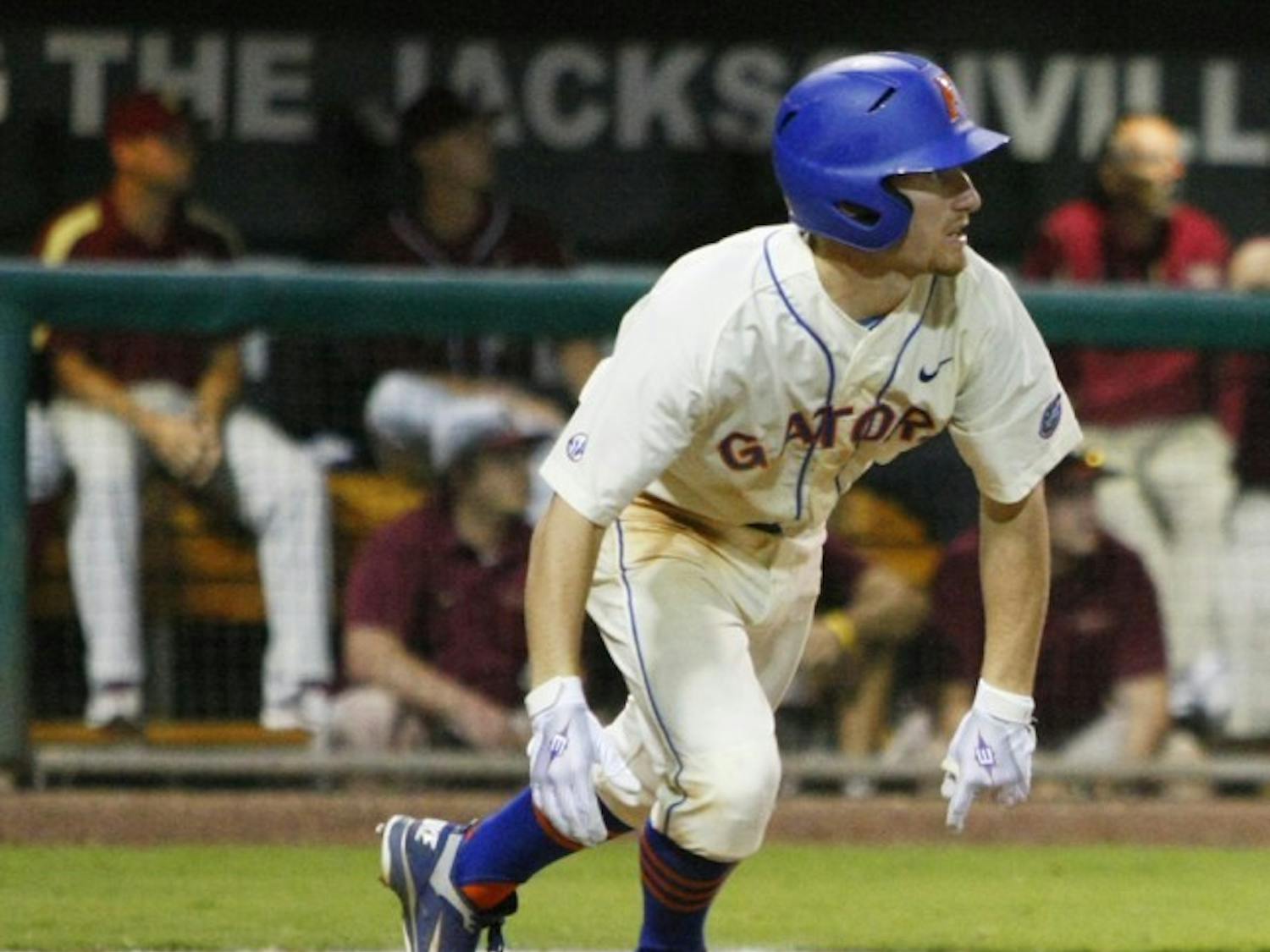 Florida freshman second baseman Casey Turgeon watches as his sixth-inning triple soars toward center fielder James Ramsey. Turgeon’s two RBI on the hit proved to be the winning runs in UF’s 4-1 victory against FSU.