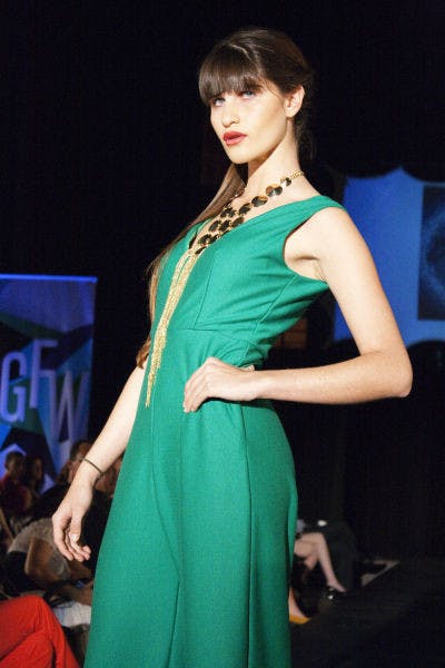 A model strikes a pose during the runway shows on Saturday night as part of Gainesville Fashion Week.