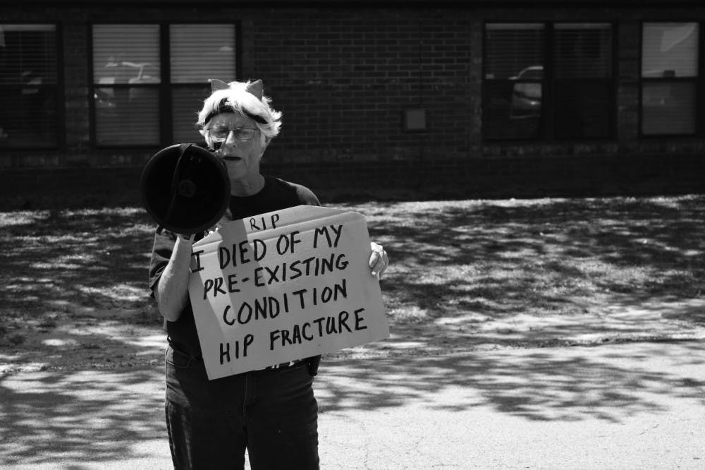 One protester spoke at the die-in about an accident that resulted in a hip fracture. Under the American Health Care Act, she said she would be denied coverage since the fracture could be considered a pre-existing condition.