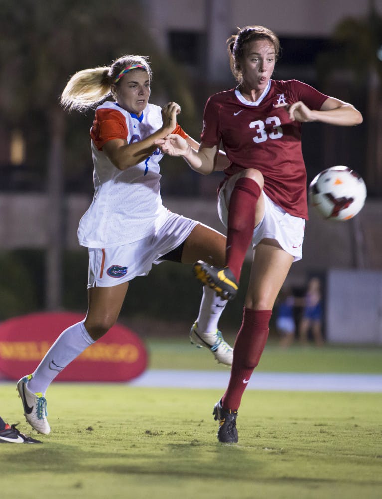 Savannah Jordan (left) battles for the ball during Florida’s 3-0 victory against Alabama on Sept. 20.