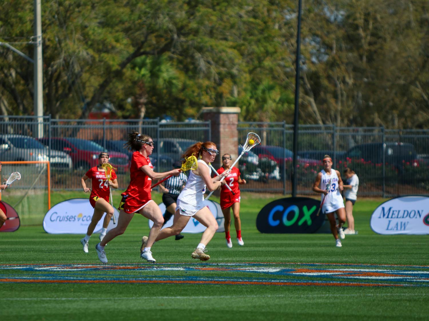 Florida midfielder Madison Waters carries the ball in her crosse in the Gators' 14-13 loss to the No. 6 Maryland Terrapins Saturday, Feb. 25, 2023.